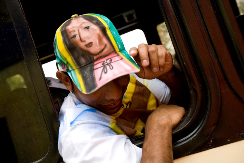 guad_chalma1_mres A pilgrim from Chalma, outsdie of Mexico City, shows off his hat, with an airbrushed Virgin of Guadalupe on it on his way home.