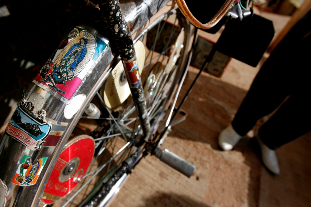 guad_jesusmaria,jalisco_mres El Bulico (the rooster as he is known in town) shows off his bike decorated with decals of the Virgen of Guadalupe and anything else he's found while working in the states from the past thirty years.