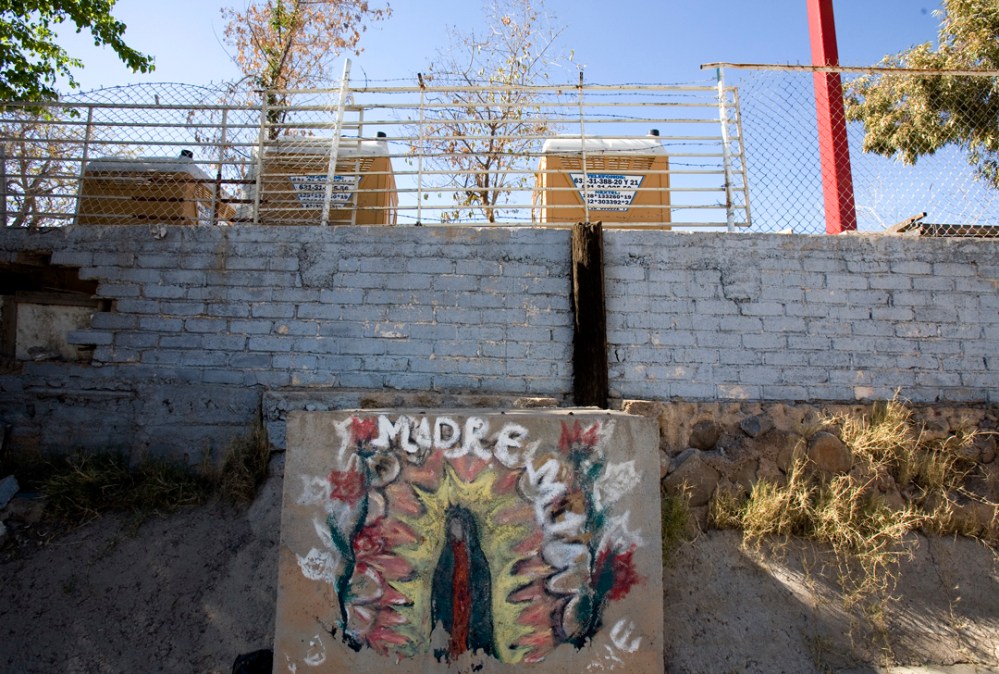 guad_nogales3_lres The Virgen of Guadalupe chalk painted onto a wall in a wash in Nogales, Sonora, Arizona.